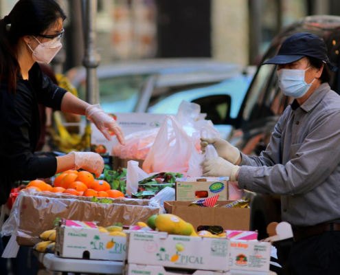 A street vendor sold fruits and vegetables on Beach Street in Chinatown. // LANE TURNER FROM GLOBE STAFF