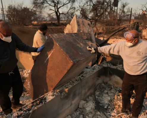 Kenneth Snowden, left, surveys the damage to his fire-ravaged property with his brother Kim, center, and Ronnie in the aftermath of the Eaton Fire on Friday, Jan. 10, 2025, in Altadena, Calif. (AP Photo/Jae C. Hong)