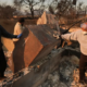 Kenneth Snowden, left, surveys the damage to his fire-ravaged property with his brother Kim, center, and Ronnie in the aftermath of the Eaton Fire on Friday, Jan. 10, 2025, in Altadena, Calif. (AP Photo/Jae C. Hong)