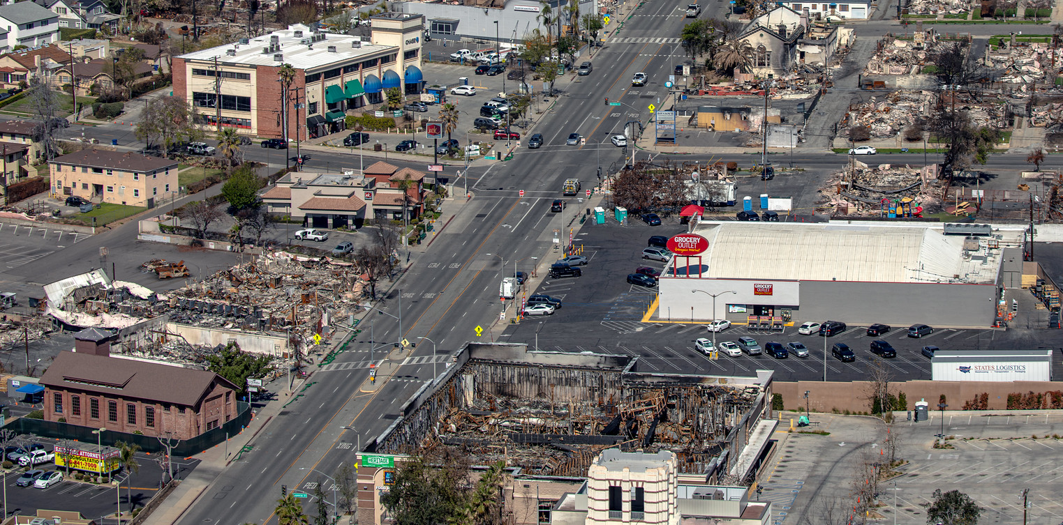 Altadena Business Corridor after the Eaton Fire Aerial view of businesses in Altadena, California, showing widespread destruction from the Eaton Fire in January 2025.
